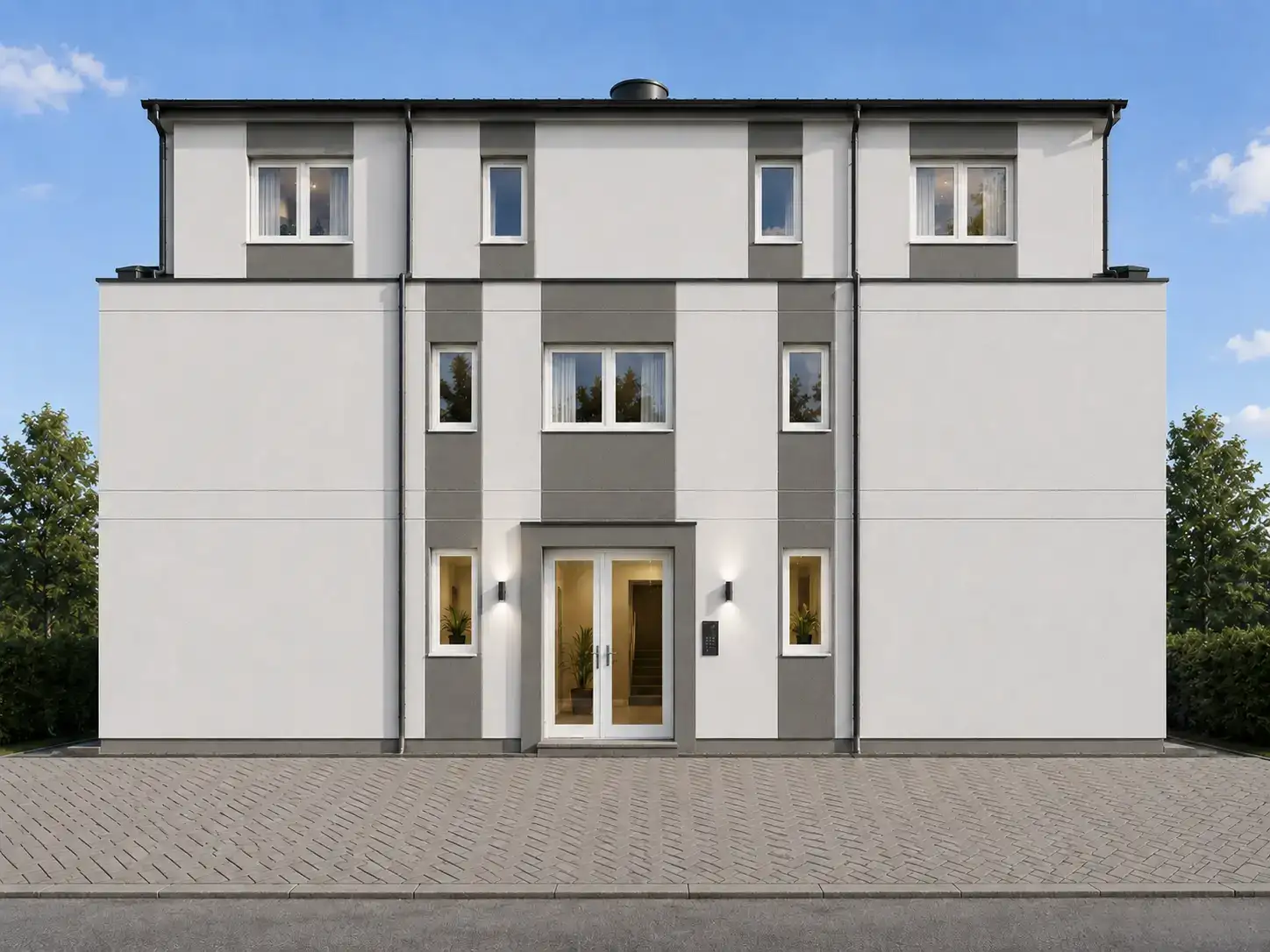 Nord-Ost-Ansicht mit Eingangsbereich, weißen Fenstern und grau abgesetzter Fassade